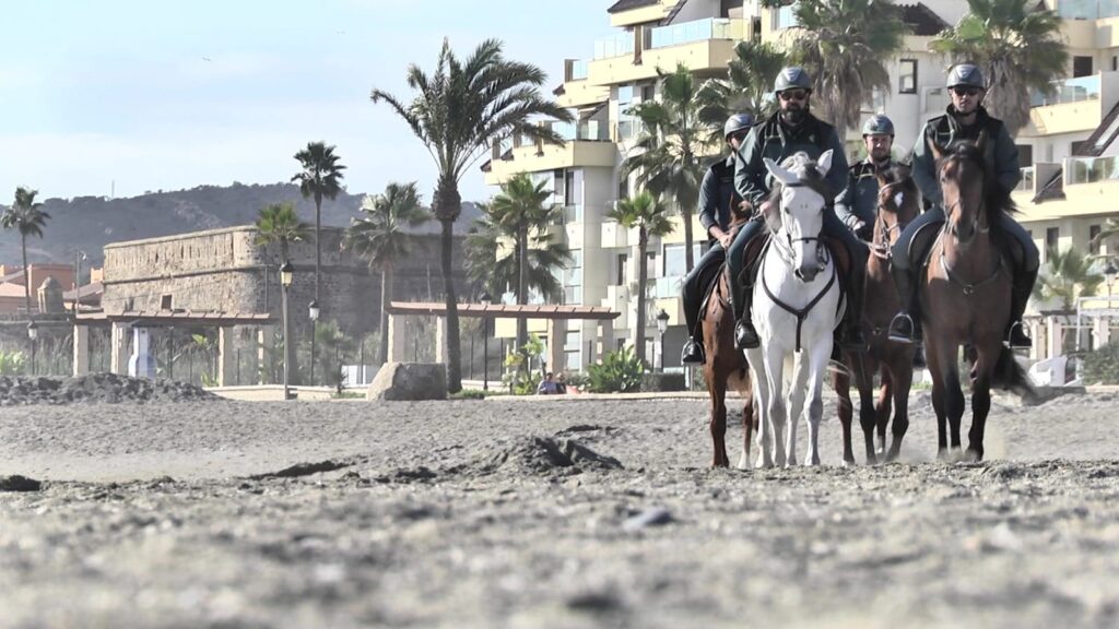 Guardia Civil mounted officers on the beach in Castillo